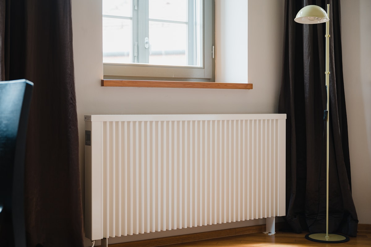 A modern radiator fitted beneath a window