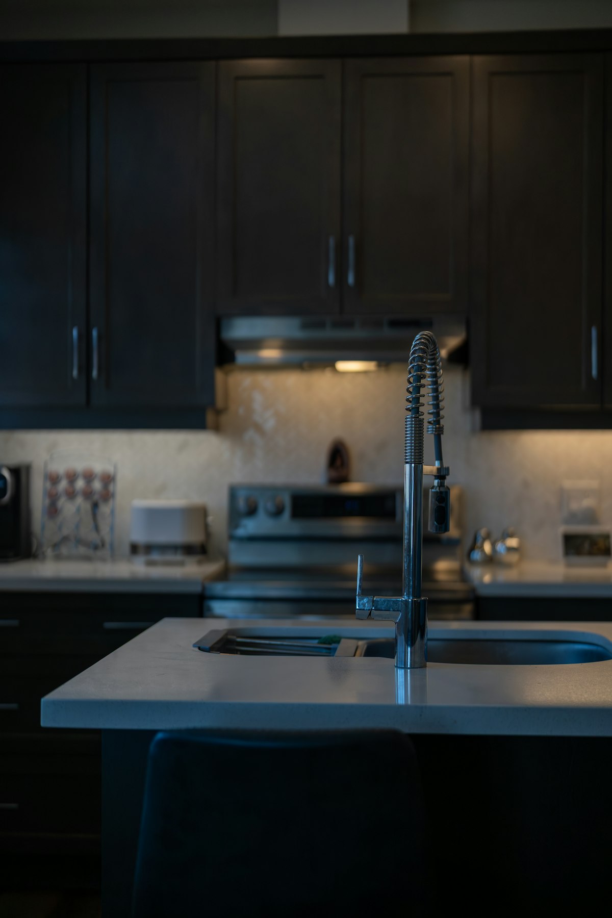 A modern kitchen sink and pull-down tap